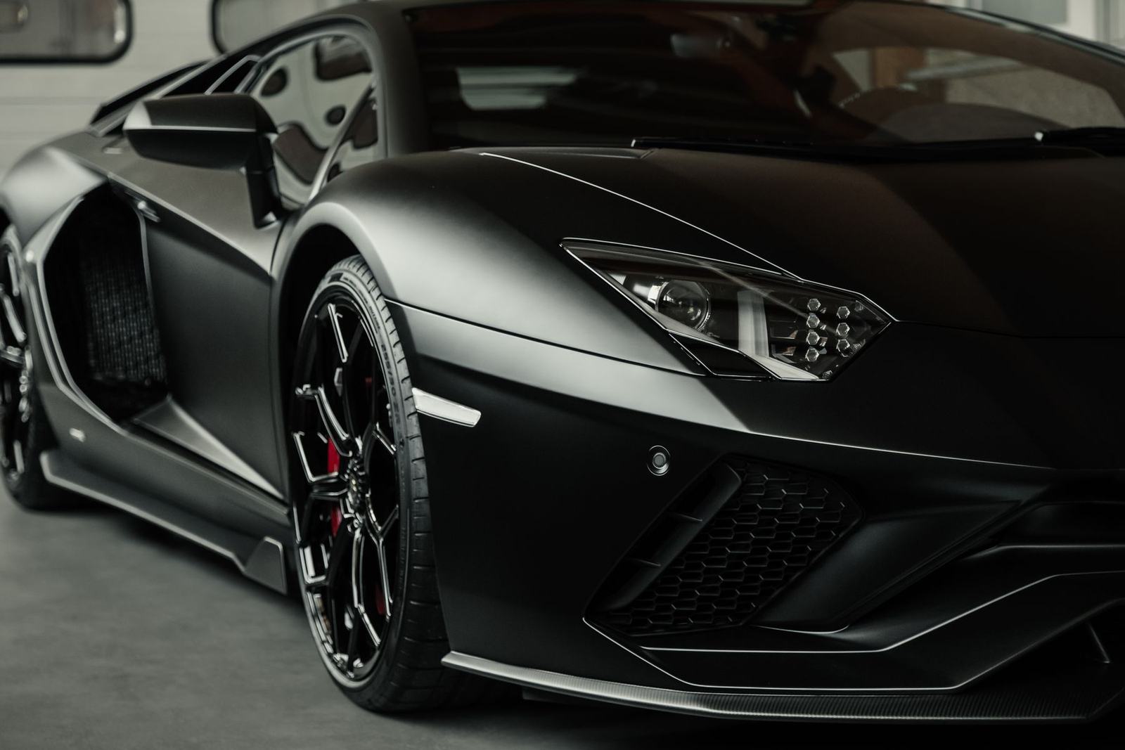 Matte black Lamborghini Aventador S front three-quarter