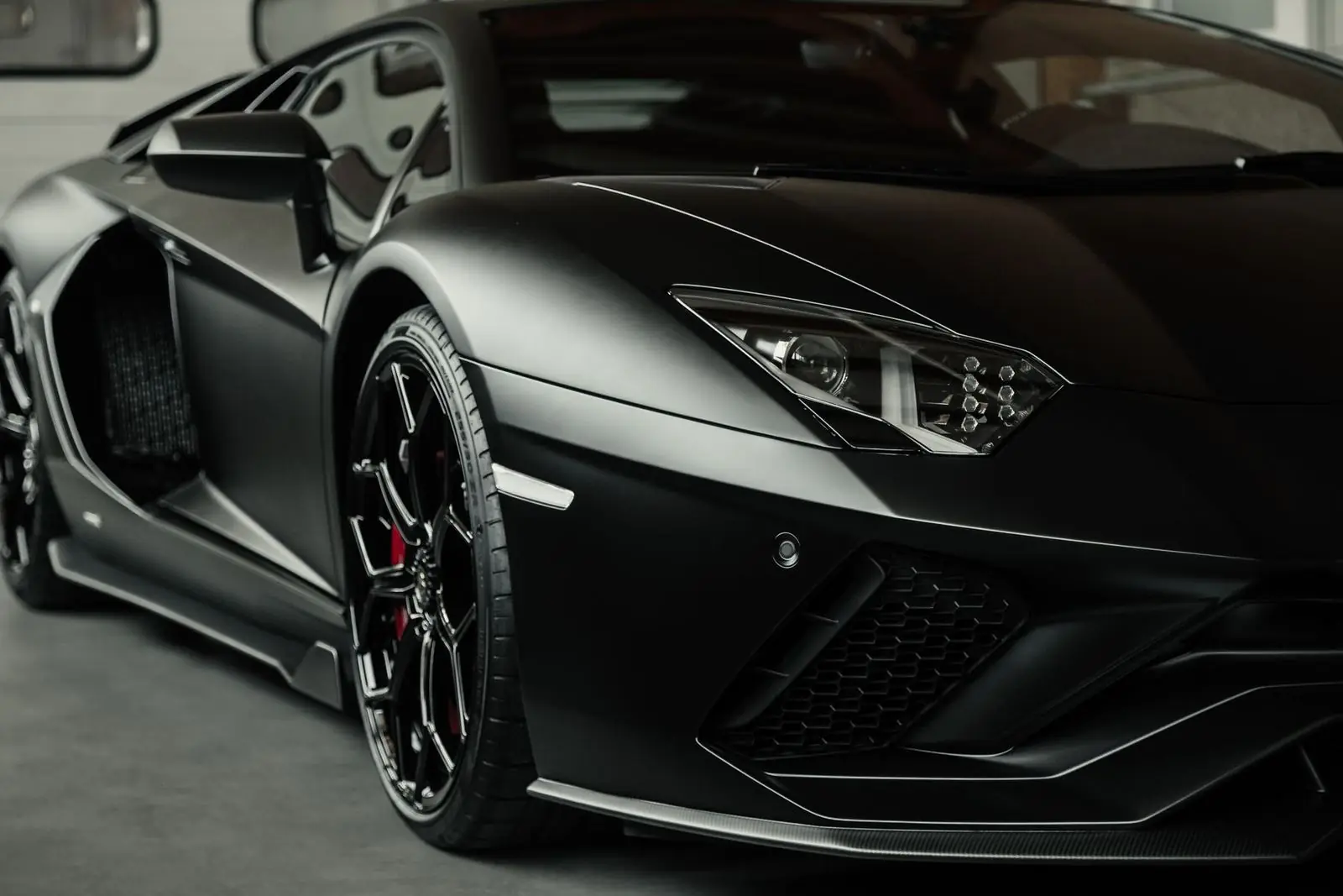 Matte black Lamborghini Aventador S front three-quarter