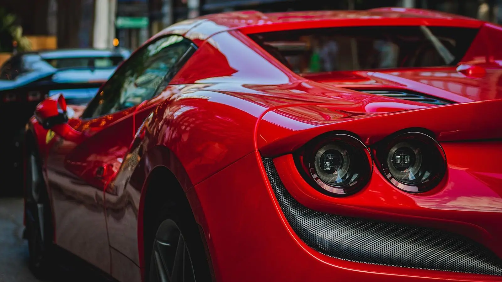 Rear of a red Ferrari with round tail lights