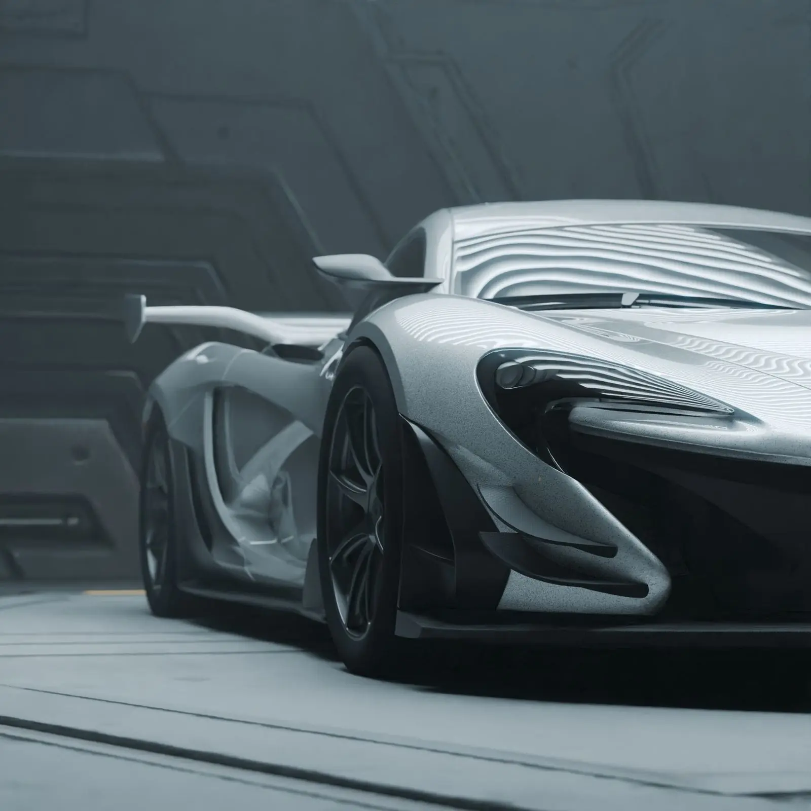 Silver McLaren P1 in a high-tech garage