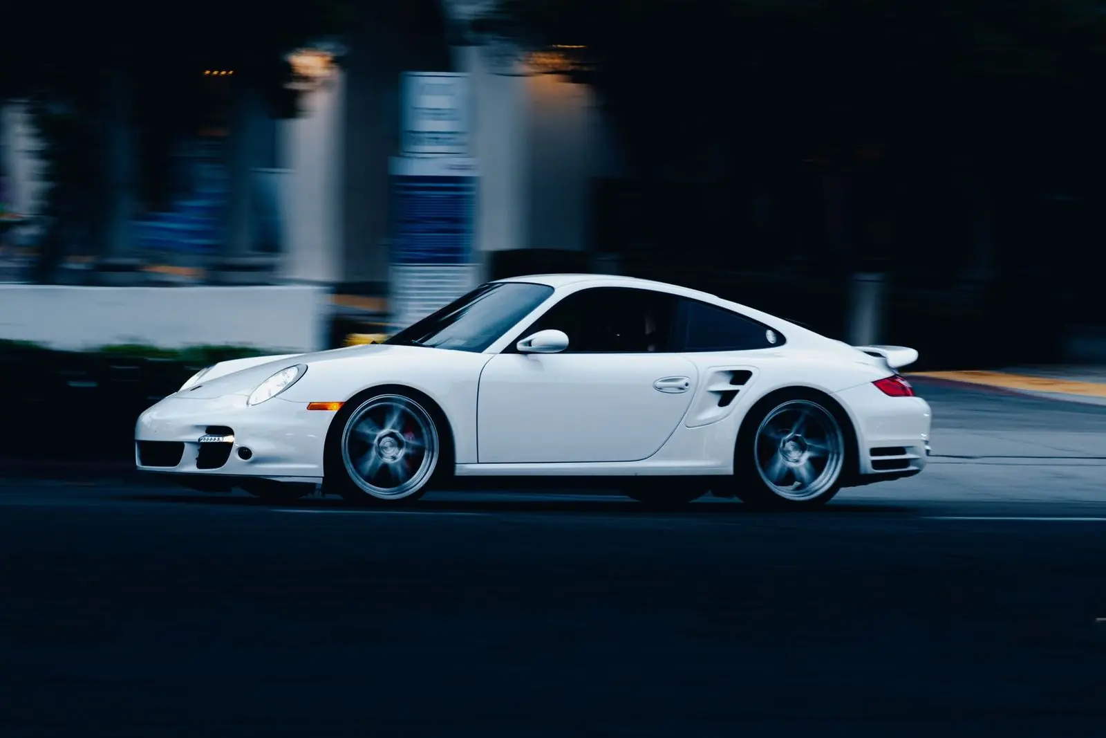 White Porsche 911 Turbo at speed at night